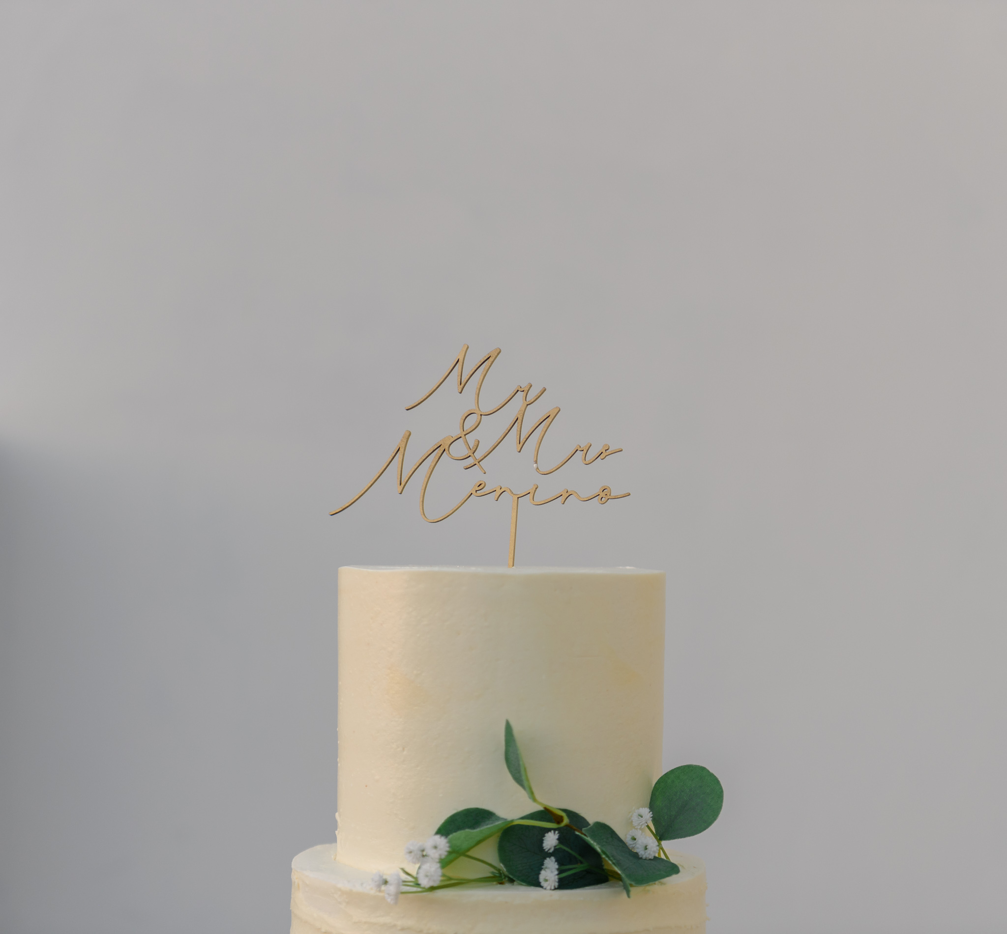 Elegant wedding cake with personalized topper